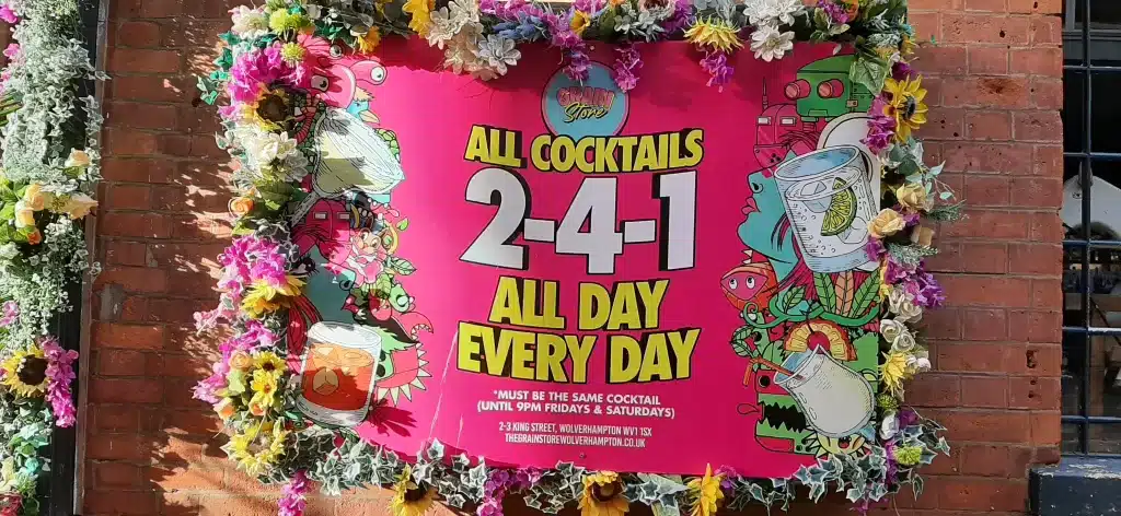 Signage advertising 2-4-1 cocktails at a bar in wolverhampton.